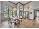 Elegant dining room with hardwood floors, high ceilings, and modern light fixture at 1745 Seneca Blvd, Winter Springs, FL 32708