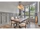 Elegant dining room features high ceilings, modern light fixture, and large windows at 1745 Seneca Blvd, Winter Springs, FL 32708
