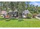 Charming front exterior featuring a landscaped yard and a welcoming entrance at 1745 Seneca Blvd, Winter Springs, FL 32708