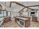 Spacious kitchen featuring stainless steel appliances, granite countertops, and wooden beams at 1745 Seneca Blvd, Winter Springs, FL 32708