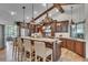 Gourmet kitchen with stainless steel appliances, granite countertops, and a large island at 1745 Seneca Blvd, Winter Springs, FL 32708
