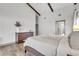 Main bedroom features exposed beams, neutral walls, and luxury vinyl plank flooring at 1745 Seneca Blvd, Winter Springs, FL 32708