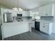 Modern kitchen featuring stainless steel appliances, quartz countertops, and stylish backsplash at 215 Hollowbrook Cir, Daytona Beach, FL 32114