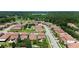 Aerial view of homes in a vibrant community with lush landscaping and tile roofs at 2325 Bella Luna Cir, Lakeland, FL 33810