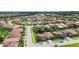 Expansive aerial view of the Terra Largo neighborhood showcasing homes with lush landscaping at 2325 Bella Luna Cir, Lakeland, FL 33810