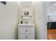 A half bath with a white vanity is conveniently located near the kitchen at 2325 Bella Luna Cir, Lakeland, FL 33810