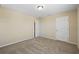 Neutral carpeted bedroom with two closets and base trim along the perimeter of the room at 2325 Bella Luna Cir, Lakeland, FL 33810