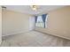 Bright bedroom features neutral walls, plush carpet, and a modern ceiling fan at 2325 Bella Luna Cir, Lakeland, FL 33810