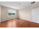 Cozy bedroom with wood floors, a large window, and a neutral color palette providing a calming atmosphere at 2325 Bella Luna Cir, Lakeland, FL 33810