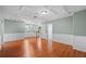 Large bonus room with wainscoting, plenty of space, and wood floors at 2325 Bella Luna Cir, Lakeland, FL 33810