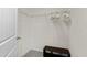 Walk-in closet with wire shelving and a bench for storage and organization at 2325 Bella Luna Cir, Lakeland, FL 33810