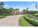 Elegant clubhouse entrance with well-manicured landscaping, showcasing community's welcoming atmosphere at 2325 Bella Luna Cir, Lakeland, FL 33810