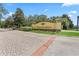 Elegant Terra Largo community entrance with manicured landscaping and brick-paved drive at 2325 Bella Luna Cir, Lakeland, FL 33810