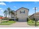Charming two-story home with well-maintained landscaping and a paved driveway at 2325 Bella Luna Cir, Lakeland, FL 33810