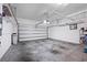Spacious two-car garage with overhead storage racks and ample room for vehicles at 2325 Bella Luna Cir, Lakeland, FL 33810