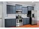 Kitchen featuring stone countertops, stainless steel appliances, and plenty of cabinet space at 2325 Bella Luna Cir, Lakeland, FL 33810