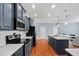 Modern kitchen featuring stainless steel appliances, ample counter space, and blue cabinets at 2325 Bella Luna Cir, Lakeland, FL 33810