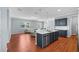 Open floor plan featuring a kitchen with a large island and stainless steel appliances at 2325 Bella Luna Cir, Lakeland, FL 33810