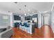 Open-concept kitchen with an island, stainless steel appliances, and stylish bar stools offering a modern design at 2325 Bella Luna Cir, Lakeland, FL 33810