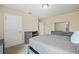 Main bedroom featuring gray furniture, carpet and a door leading to other rooms at 2325 Bella Luna Cir, Lakeland, FL 33810