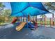 Community playground featuring slides, climbing walls, and a covered play area for sunny days at 2325 Bella Luna Cir, Lakeland, FL 33810