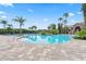 Resort-style pool area with lush tropical landscaping and plenty of seating at 2325 Bella Luna Cir, Lakeland, FL 33810