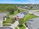 Aerial view of a beautiful home with well-maintained landscaping and a long driveway at 2627 Autumn Creek Cir, Kissimmee, FL 34747