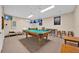 Finished basement featuring a pool table, foosball table, and a television at 2627 Autumn Creek Cir, Kissimmee, FL 34747