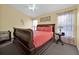 Comfortable bedroom with queen size bed, ceiling fan and natural light at 2627 Autumn Creek Cir, Kissimmee, FL 34747