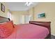 Comfortable bedroom featuring a plush bed and a TV for relaxing entertainment at 2627 Autumn Creek Cir, Kissimmee, FL 34747