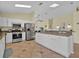 Modern kitchen with stainless steel appliances, granite countertops, and white cabinetry at 2627 Autumn Creek Cir, Kissimmee, FL 34747