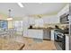 Kitchen with stainless steel appliances, granite countertops, and a breakfast nook area at 2627 Autumn Creek Cir, Kissimmee, FL 34747