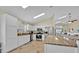 Spacious kitchen with white cabinetry, granite countertops, stainless steel appliances and eat in breakfast bar at 2627 Autumn Creek Cir, Kissimmee, FL 34747