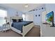 Nautical-themed bedroom featuring a plush bed and a TV for relaxing entertainment at 2627 Autumn Creek Cir, Kissimmee, FL 34747