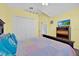 Cozy main bedroom with a vaulted ceiling, comfortable queen-size bed, and carpet flooring at 2627 Autumn Creek Cir, Kissimmee, FL 34747