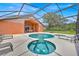 Beautiful outdoor pool area featuring a pool, jacuzzi, and outdoor dining perfect for entertaining at 2627 Autumn Creek Cir, Kissimmee, FL 34747