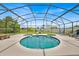 Screened-in pool and patio features custom-shaped pool and plenty of room to relax at 2627 Autumn Creek Cir, Kissimmee, FL 34747
