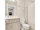 Clean bathroom with a double vanity, modern fixtures, toilet, and shower/tub combination at 2793 Nature View Rd, St Cloud, FL 34771