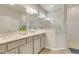 Bright bathroom with double vanity, stone countertops, and glass enclosed shower with subway tile at 2793 Nature View Rd, St Cloud, FL 34771