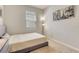 Simple bedroom featuring neutral colors, carpet, and a window for natural light at 2793 Nature View Rd, St Cloud, FL 34771