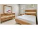 Bright bedroom featuring light wood furniture, a carpet, and a window at 2793 Nature View Rd, St Cloud, FL 34771