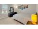 Comfortable bedroom with a large window, dresser, mirror, and bedside table with a lamp at 2793 Nature View Rd, St Cloud, FL 34771