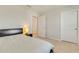 Bright bedroom with a neutral color palette, large bed, and ensuite bathroom at 2793 Nature View Rd, St Cloud, FL 34771