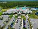 Aerial view of the community clubhouse, showcasing parking, landscaping and surrounding amenities at 2793 Nature View Rd, St Cloud, FL 34771