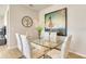 Contemporary dining room features a glass table with six chairs and modern art on the wall at 2793 Nature View Rd, St Cloud, FL 34771