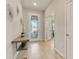 Stylish entryway with wood-look tile flooring, decorative accents, and a modern console table at 2793 Nature View Rd, St Cloud, FL 34771