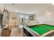 Upstairs bonus room or game room with a pool table and comfortable seating at 2793 Nature View Rd, St Cloud, FL 34771
