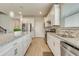 Contemporary kitchen featuring light cabinetry, granite countertops, and stainless steel appliances at 2793 Nature View Rd, St Cloud, FL 34771