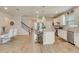 Open-concept kitchen with a large island, stainless steel appliances, and seamless flow to living area at 2793 Nature View Rd, St Cloud, FL 34771