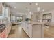 Spacious kitchen with granite island, stainless appliances, and open view to living and dining areas at 2793 Nature View Rd, St Cloud, FL 34771